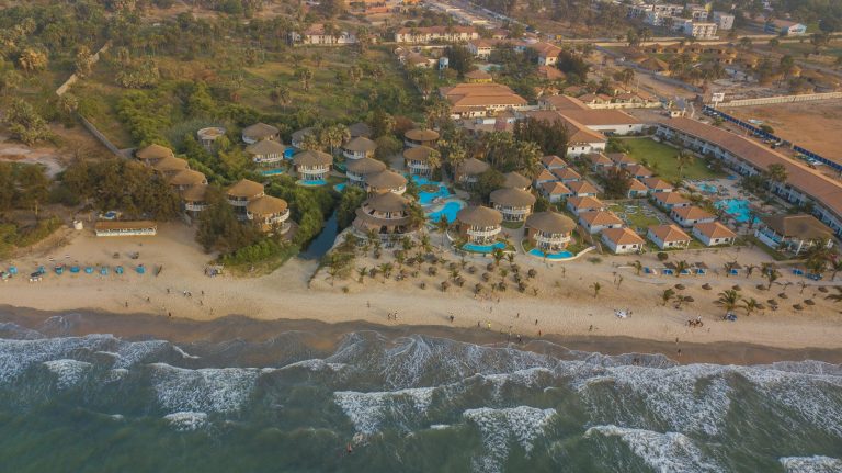 Stunning aerial capture of a beachfront resort in Gambia with coastal beauty.